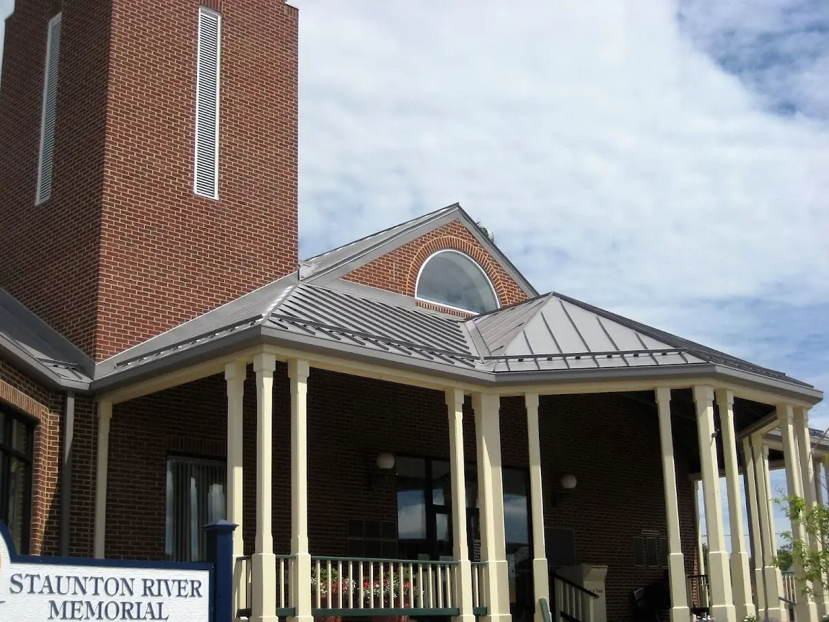 Skilled roofing craftsmen working on a residential roof in Huntsville